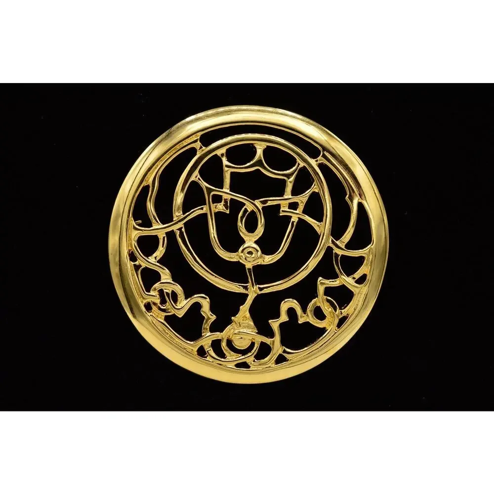 Mary McFadden brooch strive